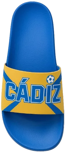 Zapatillas de casa personalizadas del Cádiz CF color amarillo con ribetes azules y escudo oficial.